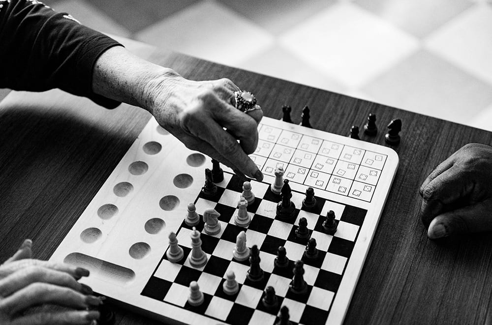 Two people compete in a game of chess
